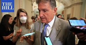 Protesters demonstrate outside Manchin's houseboat over opposition to reconciliation package