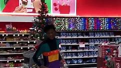 Black man jumps into Christmas tree in Target
