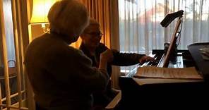 Sylvia Killman gives Thomas Lauderdale a piano lesson