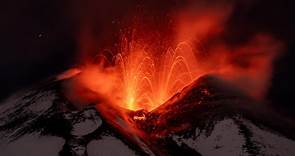 Mount Etna: Volcano sprays lava into Sicily's night sky