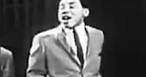 Smokey Robinson and The Miracles singing their 1961 hit “Shop Around.”