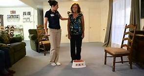 Placing alternate foot on step or stool while standing unsupported