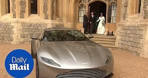 Princess Beatrice helps Princess Eugenie into Aston Martin
