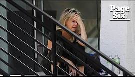 Heather Locklear appears distressed, bizarrely walks on ledge of office building
