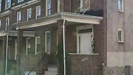 Man's body found stabbed, stuffed in storage container on West Baltimore porch