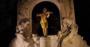 Statue of Johann Strauss in Vienna, Austria at night with parallax tracking camera movement