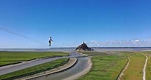 Watch this man tightrope walk across France's most iconic landmark
