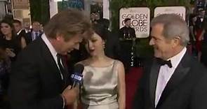 Mel Gibson and Rosalind Ross chatting on the Golden Globes Red Carpet
