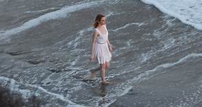Emma Stone wades in the waves for a photoshoot on Malibu beach