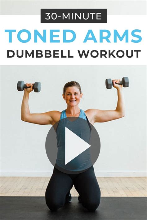 Woman Using Dumbbells At Home