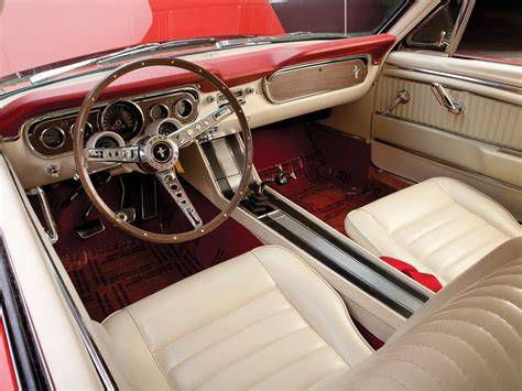 Interior view of a 1965 Ford Mustang, highlighting the dashboard