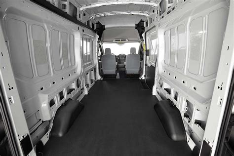 The spacious and customizable interior of a Ford Transit cargo van.