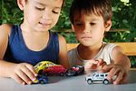 Kids Playing with Cars