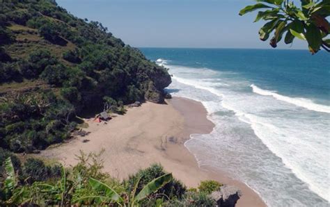 Tourists enjoy hiking and taking pictures in tirang tugurejo beach