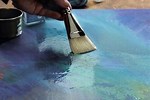 Woman Removes Varnish From Painting