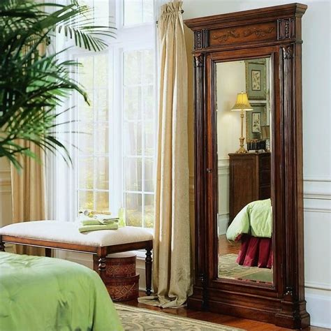 Bedroom with Hooker Furniture jewelry armoire and artwork