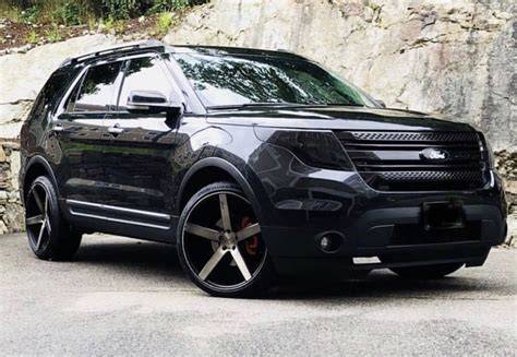 Close-up of blacked out Ford Explorer wheels and tires
