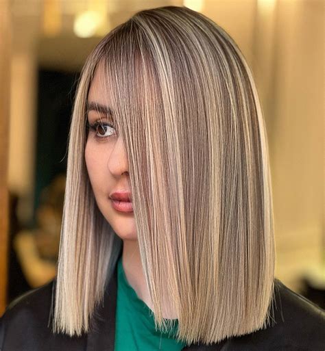 blunt cut with blonde highlights