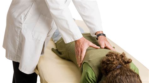 Chiropractor examining a patient
