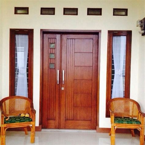 desain pintu rumah 2 pintu dengan bahan kayu jati