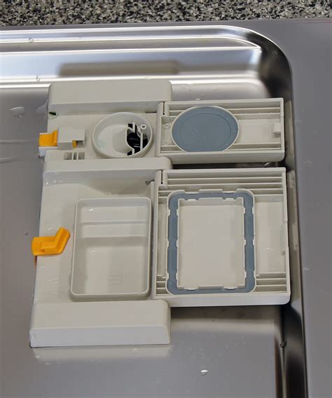 dishwasher dispenser mechanism