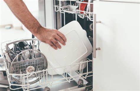 emptying the dishwasher