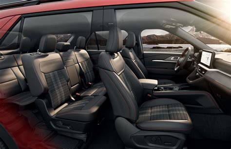 Interior view of a red Ford Explorer ST highlighting premium materials and a modern dashboard