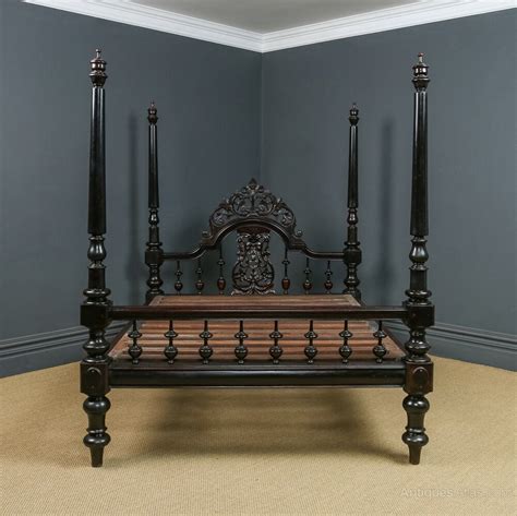 A four-poster bed in a Victorian bedroom