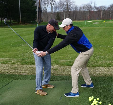Golf instructor providing mental game coaching