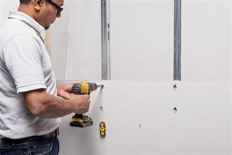 how to drill into metal studs