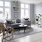 light grey living room with floor to ceiling windows