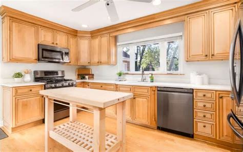 maple cabinets with white counters