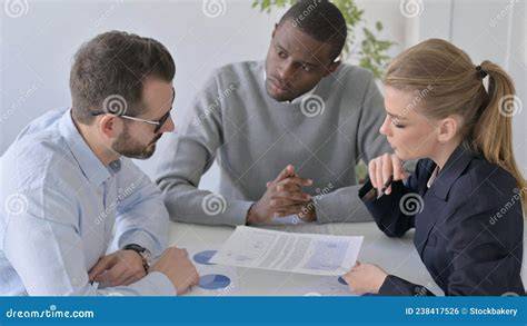 people discussing documents