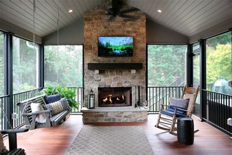 screened in porch with fireplace and tv