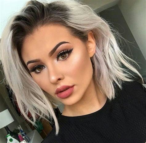 short blonde hair with black roots