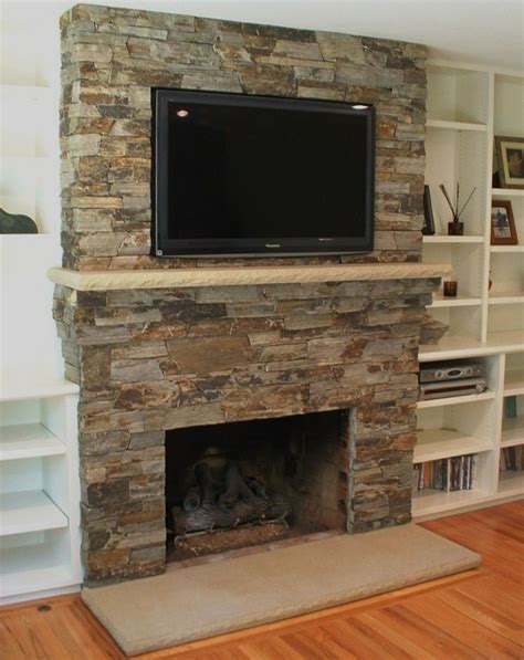 stone fireplace with tv