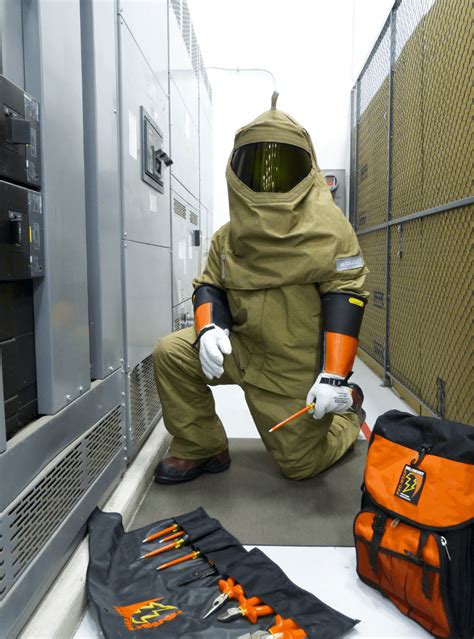 Storage of attachments for electrical safety suits