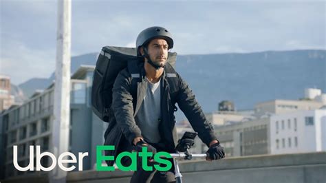 Uber Eats delivery person smiling