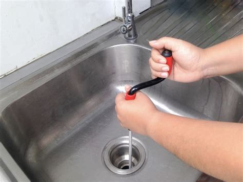 unclog nozzle with warm water