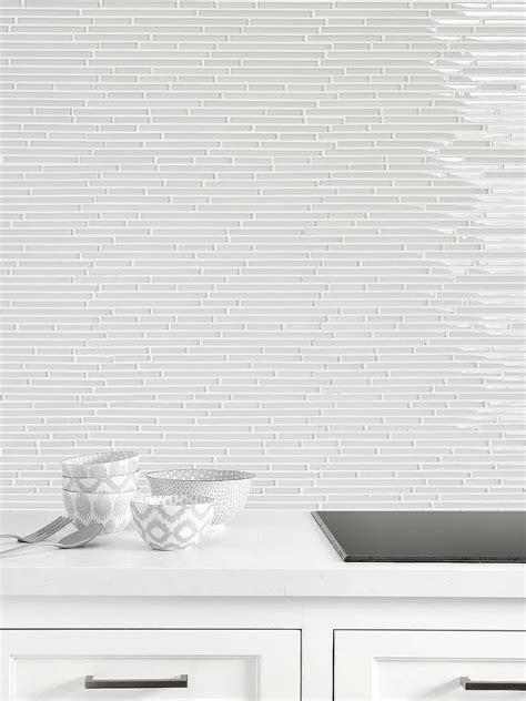 white backsplash with gray grout