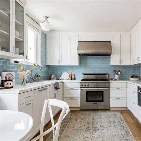 white cabinets blue backsplash