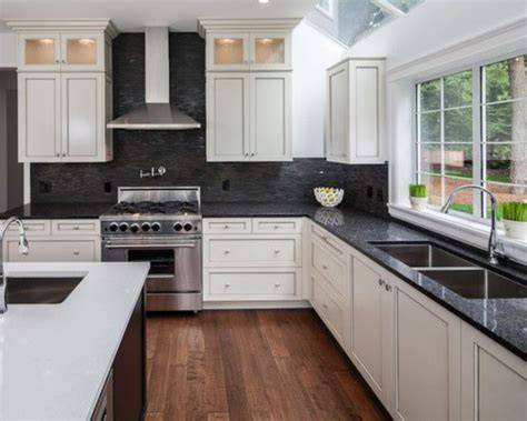 white cabinets with black backsplash