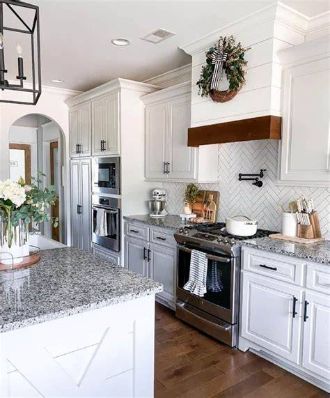 white herringbone backsplash with grey grout